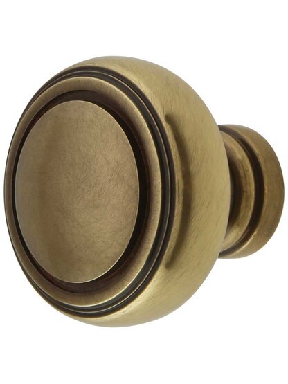 Norwich Cabinet Knob - 1 1/4 inch Diameter in Antique Brass.